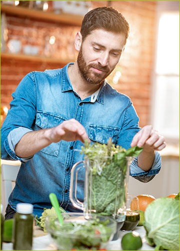 Man Blending Green Shake