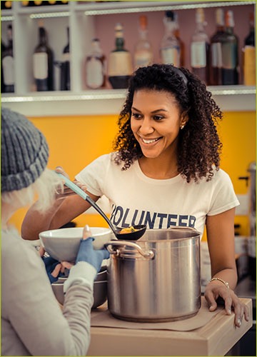 Volunteer working at a soup kitchen