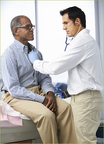 Man Getting His Heart Checked by Doctor